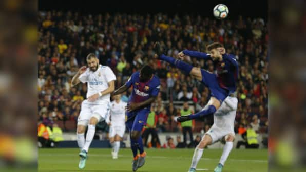 La Liga: 10-man Barcelona protect unbeaten record against Real Madrid in fast and furious El Clasico