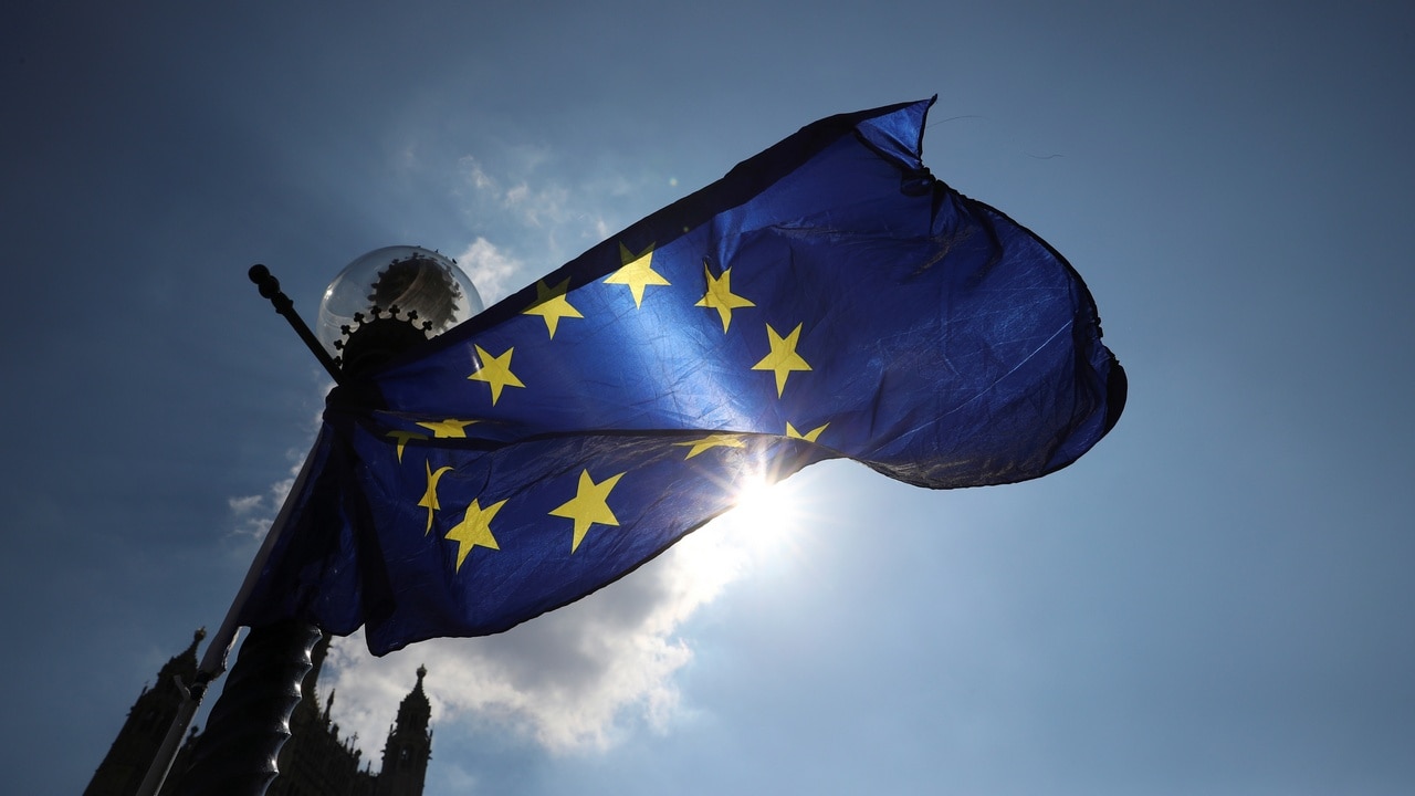 An EU flag flies from a lamp post opposite the Houses of Parliament, on a sunny day in London, Britain. Image: Reuters