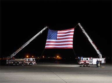 A large US flag is set up ahead of the arrival of the three US detainees after they were freed by North Korea. AFP