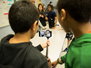 Google AR Expeditions being used by school children with selfie sticks. Image: Google
