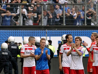Hamburg's Lewis Holtby and his teammates walk on the pitch after the side got relegated for the first time in German Bundesliga history. AP