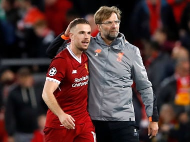 Liverpool manager Juergen Klopp celebrates with Jordan Henderson after the match. Reuters