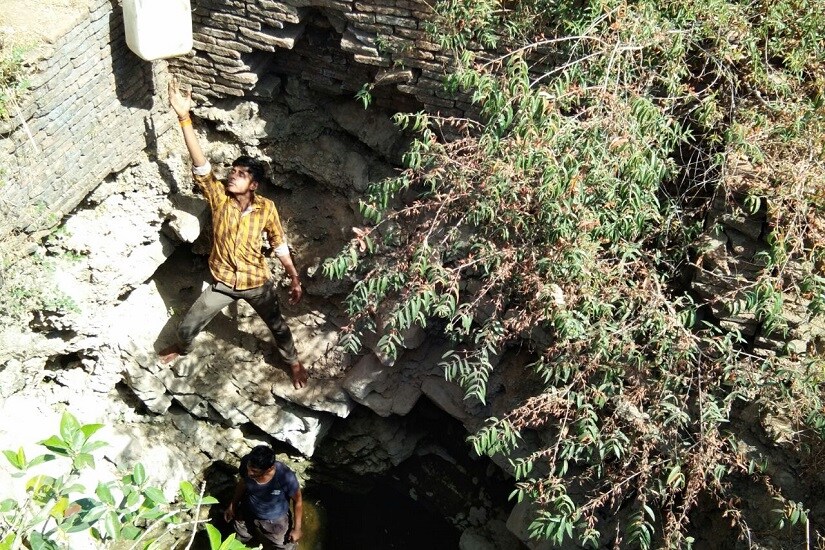 People of a small village in Tikamgarh risk their lives to fetch water from an ancient dug well. Firstpost pics