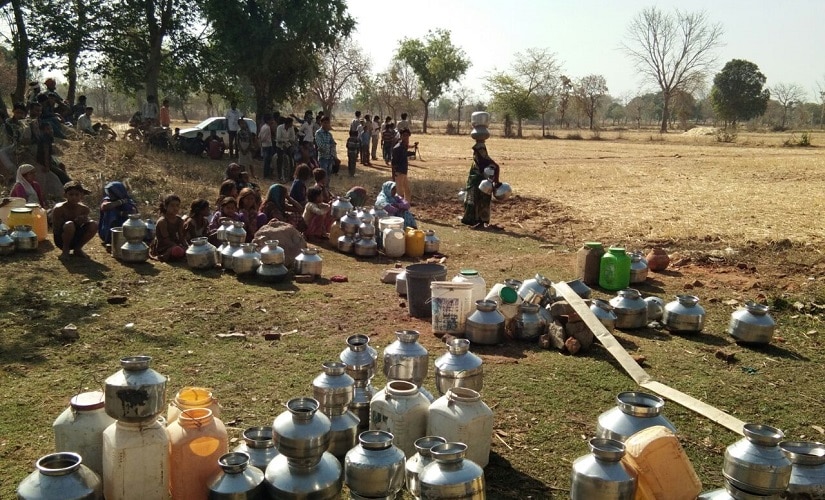 Villagers in Ataria walk down or travel on bicycles up to five kilometres to fetch water from a private tube well. Firstpost pics