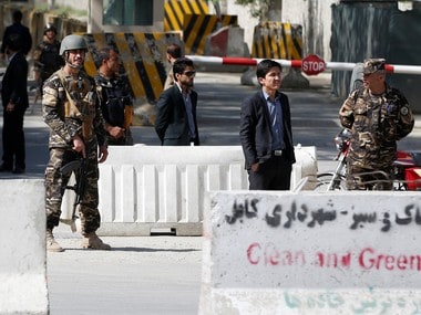 Afghan security forces stand guard near the site of a blast in Kabul. Reuters