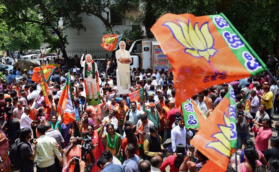 BJP workers celebrating outside the party office in Bengaluru. BJP activists and leaders celebrated in both Bengaluru and New Delhi, waving party flags and shouting slogans hailing Prime Minister Narendra Modi, their main vote-getter, and Amit Shah. PTI BJP workers celebrating outside the party office in Bengaluru. BJP activists and leaders celebrated in both Bengaluru and New Delhi, waving party flags and shouting slogans hailing Prime Minister Narendra Modi, their main vote-getter, and Amit Shah. PTI