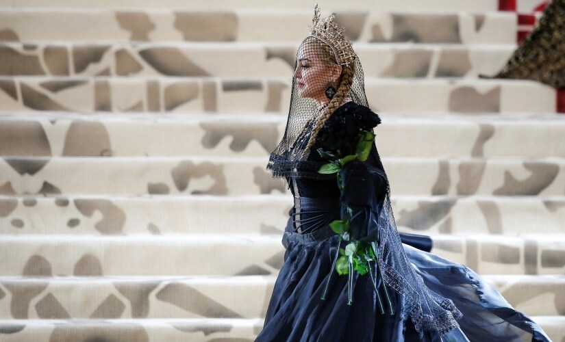 Singer-Songwriter Madonna arrives at the Metropolitan Museum of Art Costume Institute Gala (Met Gala) to celebrate the opening of "Heavenly Bodies: Fashion and the Catholic Imagination" in the Manhattan borough of New York, U.S., May 7, 2018. REUTERS/Brendan McDermid - RC1A6509AA30