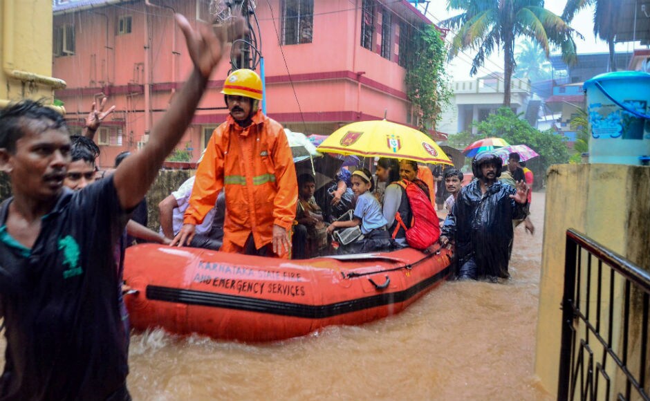Boats had to be used to ferry stranded people, including school children. PTI