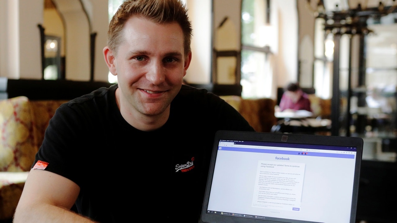 Austrian lawyer and privacy activist Max Schrems displays his Facebook account's updated terms page during a Reuters interview in a cafe in Vienna, Austria, May 22, 2018. Picture taken May 22, 2018. REUTERS/Heinz-Peter Bader - RC1F006F8E30