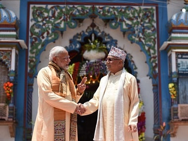 Prime Minister Narendra Modi being welcomed by Nepal's prime minister KP Sharma Oli. Twitter @MEAIndia