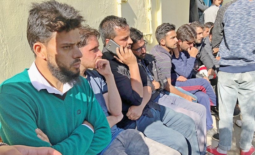 Students of Kashmir University attend the funeral procession of lecturer Mohammad Rafi Bhat who was killed along with five Hizb-ul-Mujahideen militants at an encounter in Shopian on Sunday. PTI