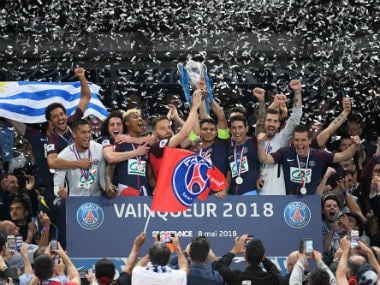 Paris Saint-Germain's players celebrate with trophy. Reuters