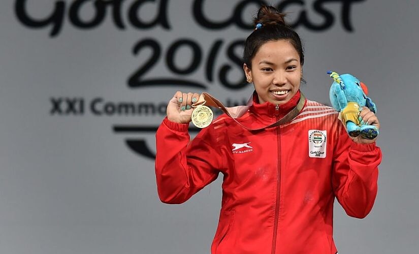 Gold Coast: Gold medalist Indian weightlifter Chanu Saikhom poses for a photo during the medal ceremony of women's 48kg weightlifting event during the Commonwealth Games 2018 in Gold Coast, on Thursday. PTI Photo by Manvender Vashist (PTI4_5_2018_000049B)