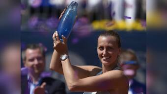 Prague Open: Petra Kvitova fights back from a set down against Mihaela Buzarnescu to win third title of the year