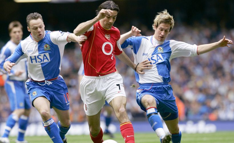 Arsenal's Robert Pires is challenged by Blackburn Rovers' Dickov and Pedersen during their FA Cup semi-final at the Millennium Stadium on 16 April, 2005. Reuters