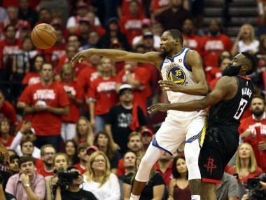 Golden State Warriors' Kevin Durant (left) is defended by Houston Rockets' James Harden. Image: Reuters
