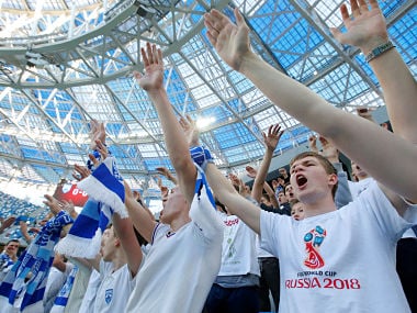 Soccer Football - Russian Football National League - FC Olimpiyets Nizhny Novgorod vs Rotor Volgograd - Nizhny Novgorod Stadium, Nizhny Novgorod, Russia - April 28, 2018 Fans cheer their team. REUTERS/Sergei Karpukhin - RC1C298009B0