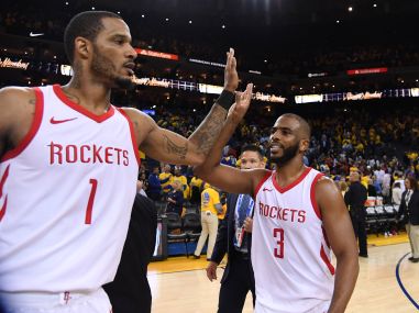 Houston Rockets' Trevor Ariza and guard Chris Paul celebrate after defeating the Golden State Warriors. Reuters