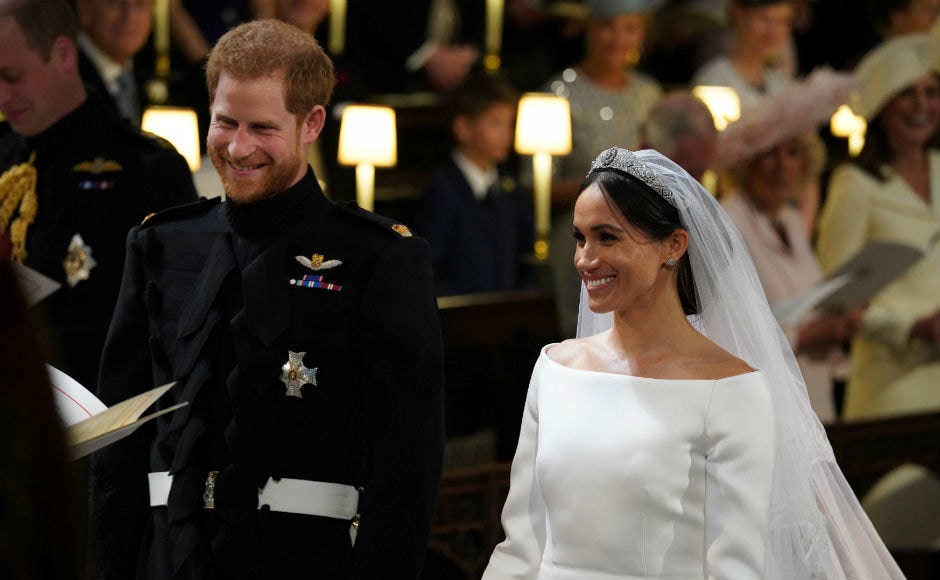 The new Duke and Duchess of Sussex exchanged vows at the altar in St. George's Chapel in an emotional event. Reuters