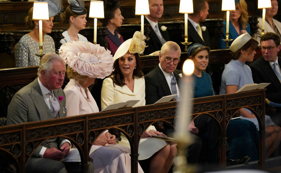 The Duchess of Cornwall, the Duchess of Cambridge, the Duke of York, Princess Beatrice, Princess Eugenie and Jack Brooksbank take their seats in St George's Chapel. Reuters