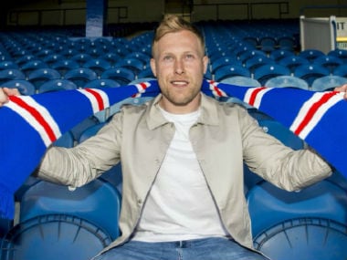 Scott Arfield poses after completing his move from Burnley to Rangers. Twitter: @scottyarf