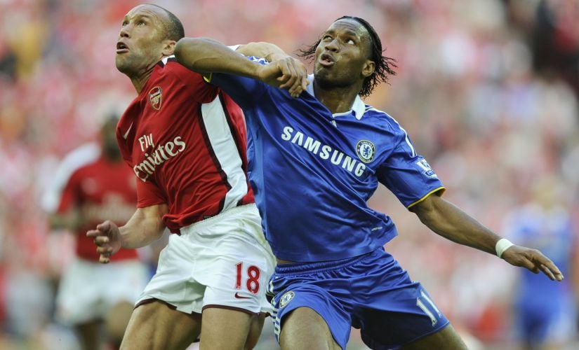 Chelsea's Didier Drogba (R) vies for the ball with Arsenal's Mikael Silvestre during the FA Cup semi-final at Wembley Stadium in London on 18 April, 2009. AFP