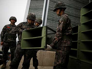 South Korean soldiers dismantle loudspeakers that were set up for propaganda broadcasts near the demilitarized zone separating the two Koreas in Paju, South Korea. Reuters