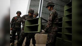 North, South Korea begin dismantling speakers blaring propaganda along border, fulfilling summit pledge