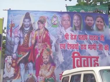 Day before wedding, poster outside Lalu Prasad Yadav's house shows Tej Pratap and wife Aishwarya Rai as Lord Shiva, Parvati Day before wedding, poster outside Lalu Prasad Yadav's house shows Tej Pratap and wife Aishwarya Rai as Lord Shiva, Parvati