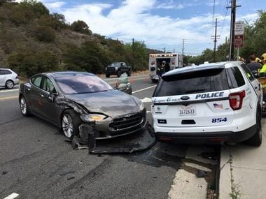 A Tesla sedan is shown after it struck a parked Laguna Beach Police Department vehicle in Laguna Beach, California, U.S. in this May 29, 2018 handout photo. Laguna Beach Police Department/Handout via REUTERS ATTENTION EDITORS - THIS IMAGE WAS PROVIDED BY A THIRD PARTY. BEST QUALITY AVAILABLE. - RC144E2FD2F0