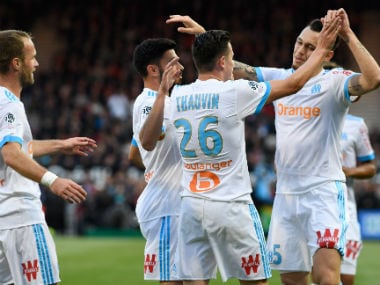 Marseille midfielder Florian Thauvin (2ndR) is congratulated by his teammates after scoring against Guingamp. AFP