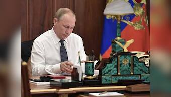 Vladimir Putin promises economic reforms as he takes oath of office for his fourth term as Russia's president