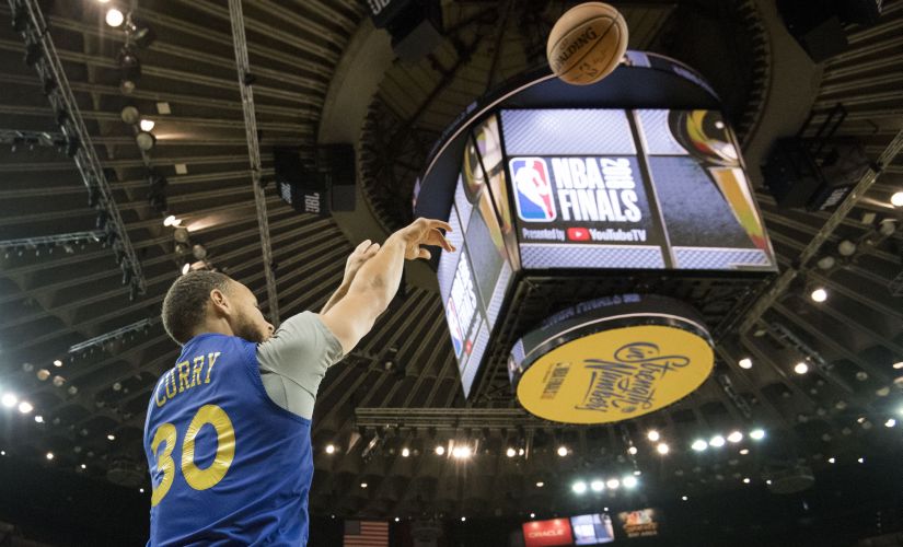Golden State Warriors' Stephen Curry (30) shoots the basketball during NBA Finals media day at Oracle Arena. Reuters