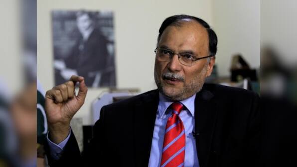 Pakistan interior minister Ahsan Iqbal survives assassination attempt at political rally, police arrests attacker