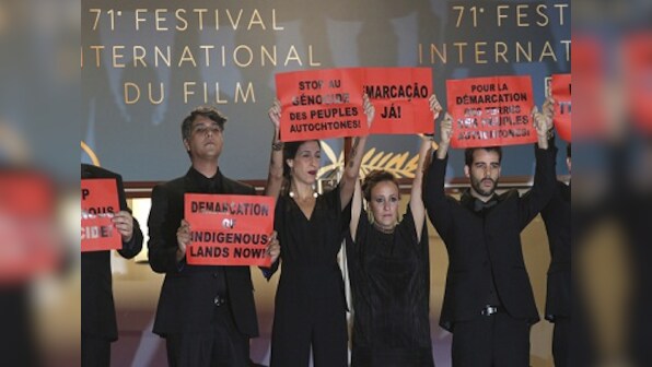 Cannes 2018: Cast, crew members of Brazilian film hold up placards to protest against 'genocide' of native people