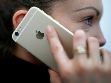 A woman uses her Apple iPhone 6. Image: Reuters
