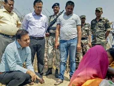 Deputy Commissioner Jitendra Singh consoling the victim’s family in Chatra on Saturday. PTI