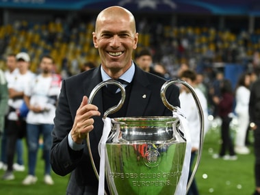 Zinedine Zidane with Real Madrid's third consecutive Champions League trophy. AFP