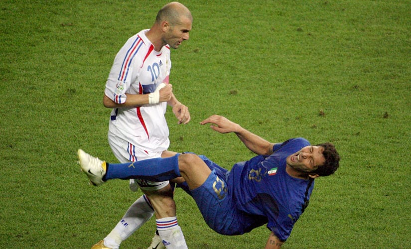(FILES) In this file photo taken on July 09, 2006 shows French midfielder Zinedine Zidane (L) gesturing after head-butting Italian defender Marco Materazzi during the World Cup 2006 final football match between Italy and France at Berlins Olympic Stadium. / AFP PHOTO / John MACDOUGALL