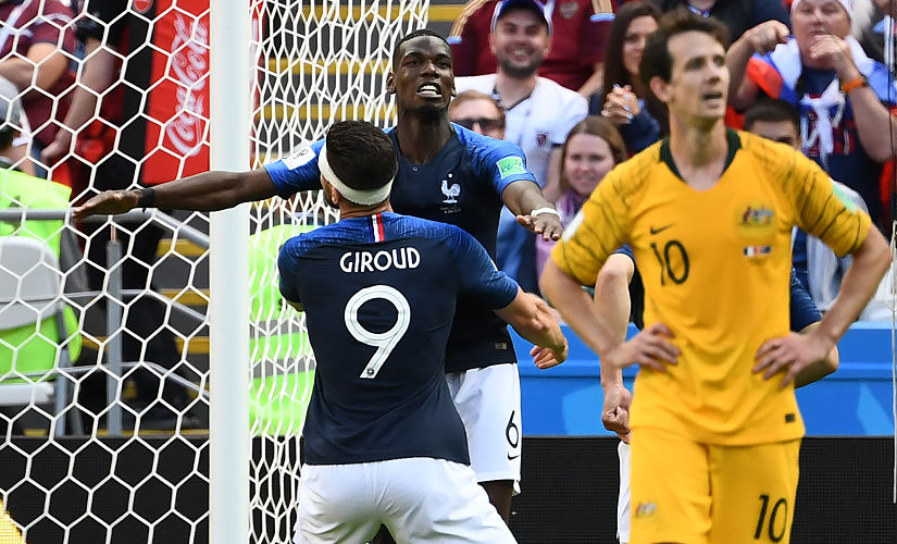 France's midfielder Paul Pogba (top) celebrates a goal with France's forward Olivier Giroud during the Russia 2018 World Cup Group C football match between France and Australia at the Kazan Arena in Kazan on June 16, 2018. / AFP PHOTO / FRANCK FIFE / RESTRICTED TO EDITORIAL USE - NO MOBILE PUSH ALERTS/DOWNLOADS