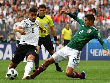 Germany's midfielder Sami Khedira (L) vies with Mexico's defender Hugo Ayala during the Russia 2018 World Cup Group F football match between Germany and Mexico at the Luzhniki Stadium in Moscow on June 17, 2018. / AFP PHOTO / Yuri CORTEZ / RESTRICTED TO EDITORIAL USE - NO MOBILE PUSH ALERTS/DOWNLOADS