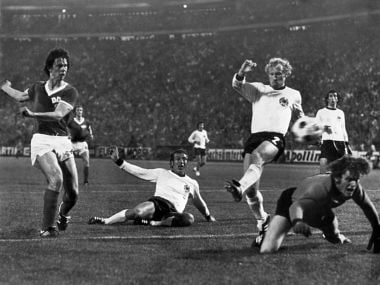 East German forward Juergen Sparwasser (L) scores the winning goal past West German defenders Horst Hoettges (C), Berti Vogts (2) and goalkeeper Sepp Maier in Hamburg. AFP
