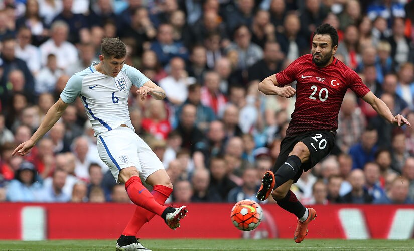 England's defender John Stones (L). AFP