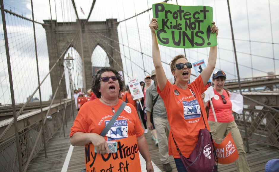 A crowd of hundreds, most wearing orange in honor of National Gun Violence Awareness Day, gathered in a park on the Brooklyn side of the Brooklyn Bridge, many holding photos or wearing T-shirts with the images of people lost, CBS New York said. AP A crowd of hundreds, most wearing orange in honor of National Gun Violence Awareness Day, gathered in a park on the Brooklyn side of the Brooklyn Bridge, many holding photos or wearing T-shirts with the images of people lost, CBS New York said. AP