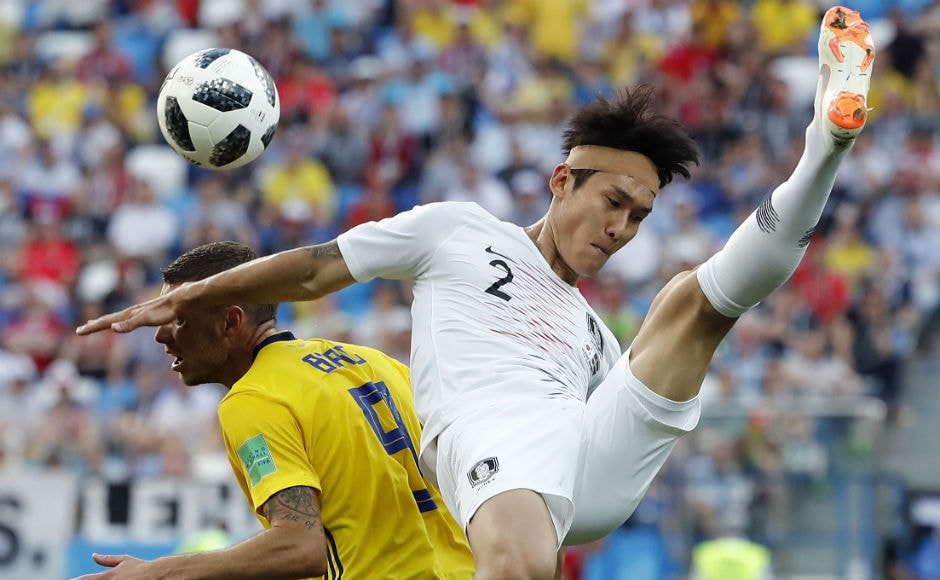 Sweden's Marcus Berg and South Korea's Lee Yong fight for possession of the ball. AP Sweden's Marcus Berg and South Korea's Lee Yong fight for possession of the ball. AP