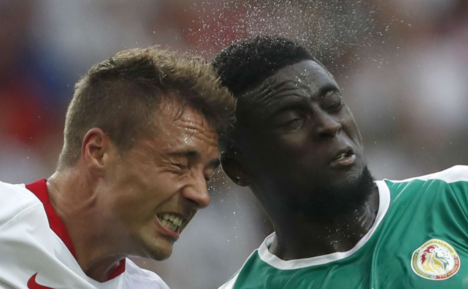 Poland's Thiago Cionek and Senegal's Alfred Ndiaye go for a header during their Group H encounter. AP Poland's Thiago Cionek and Senegal's Alfred Ndiaye go for a header during their Group H encounter. AP