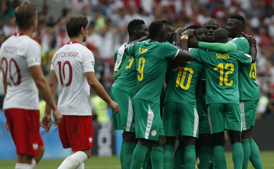 Senegal players celebrate after Poland's Thiago Cionek scored an own goal to give the Lions of Teranaga the lead. AP Senegal players celebrate after Poland's Thiago Cionek scored an own goal to give the Lions of Teranaga the lead. AP