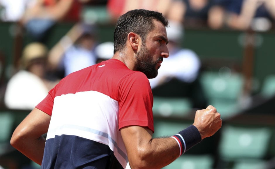 Croatia's Marin Cilic clenches his fist after scoring a point against Poland's Hubert Hurkacz during their second round match. AP Croatia's Marin Cilic clenches his fist after scoring a point against Poland's Hubert Hurkacz during their second round match. AP