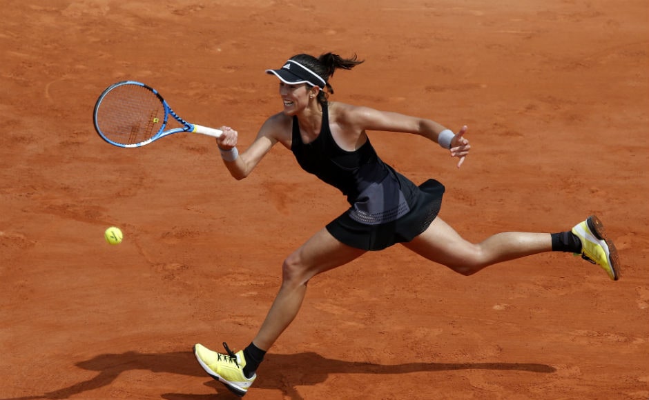 Spain's Garbine Muguruza returns the ball to France's Fiona Ferro during their second round match. AP Spain's Garbine Muguruza returns the ball to France's Fiona Ferro during their second round match. AP
