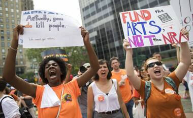 Thousands march across New York City's Brooklyn Bridge in protest to end gun violence